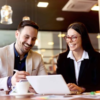 Two,Young,Businessman,Having,A,Successful,Meeting,At,Restaurant.